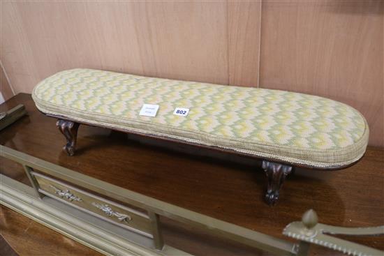 Two Victorian mahogany footstools, raised on cabriole legs W.89cm and 40cm